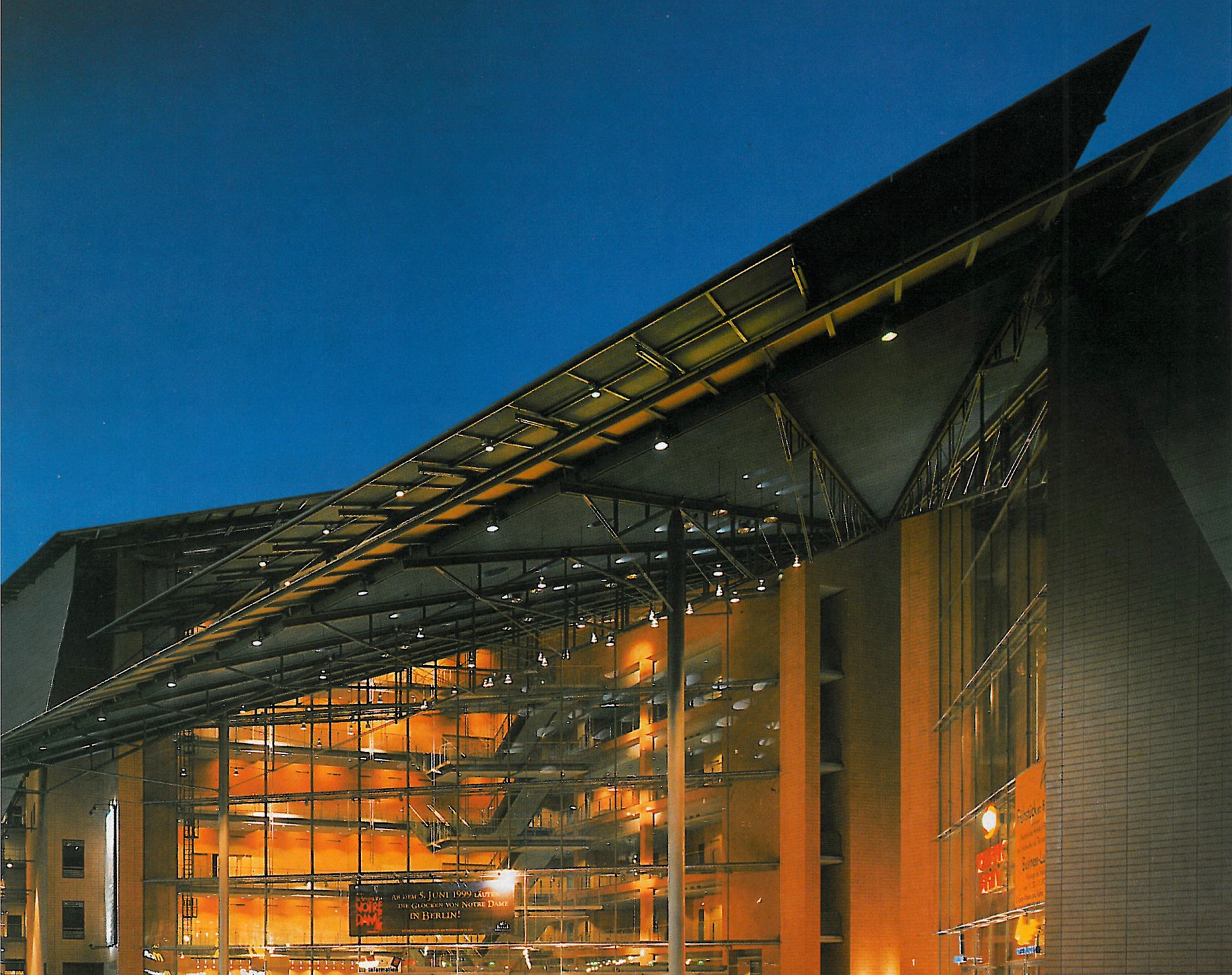 Night view of the Piano–Kohlbecker Musical Theatre and casino with its angled steel entrance canopy