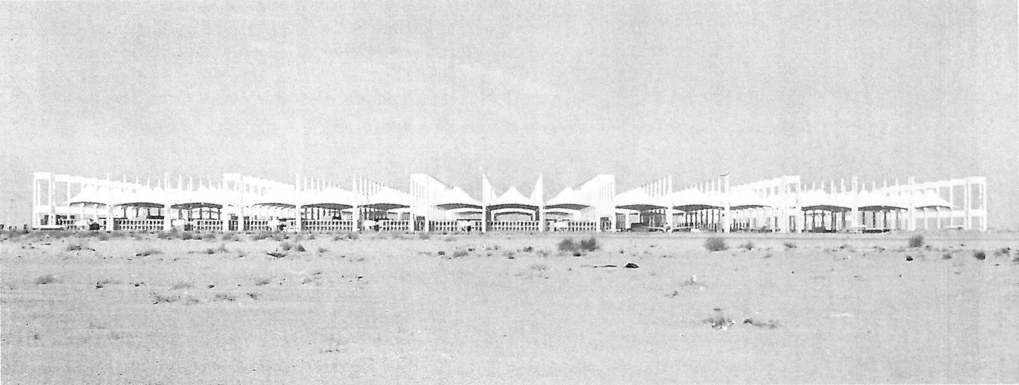 The tented roofs of the Hajj Terminal standing in open desert