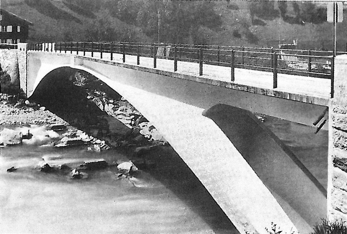 A Maillart concrete arch bridge seen from the river bank