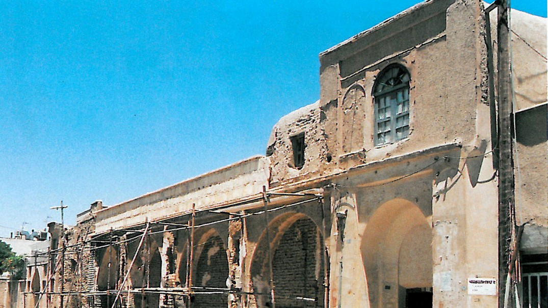 Two photographs side by side: at left a restored brick gable end with traditional clerestory window, at right the same building's central courtyard as a ruin before restoration.