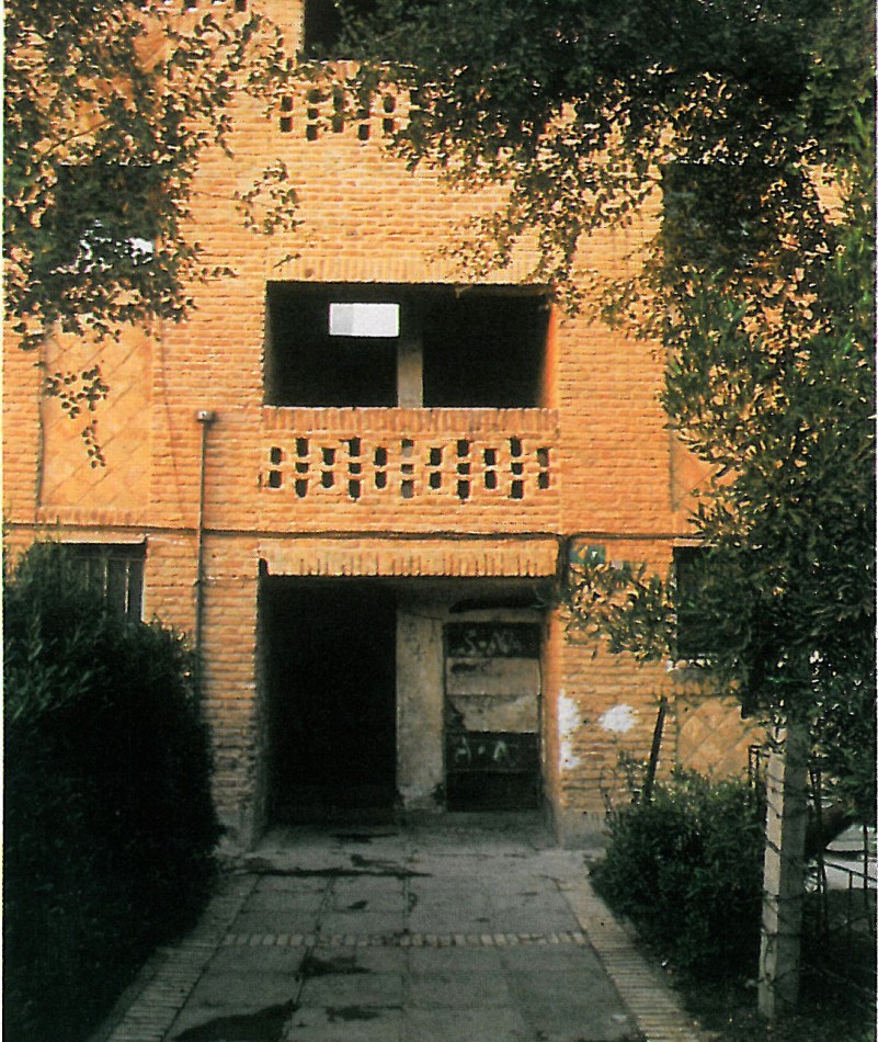 Brick apartment building exterior at Shushtar New Town with deep punched openings