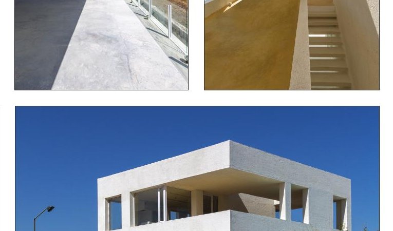 Cheshm Cheran Villa from the side in late afternoon — the layered volumes against the rolling hills