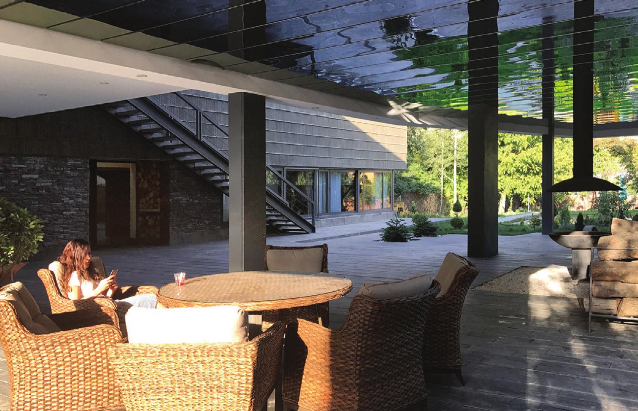 Open living hall with dining and pool view