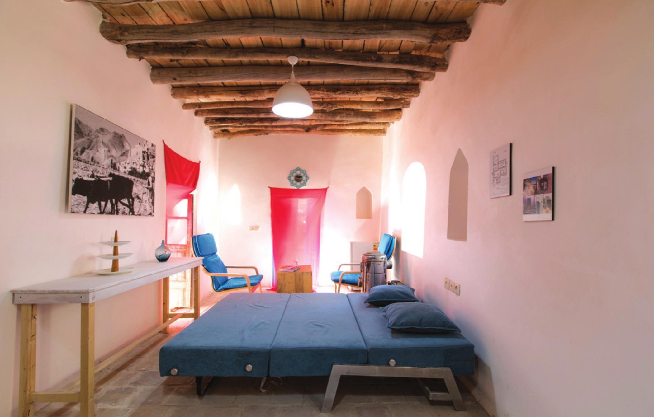 Bedroom with a single saturated wall colour