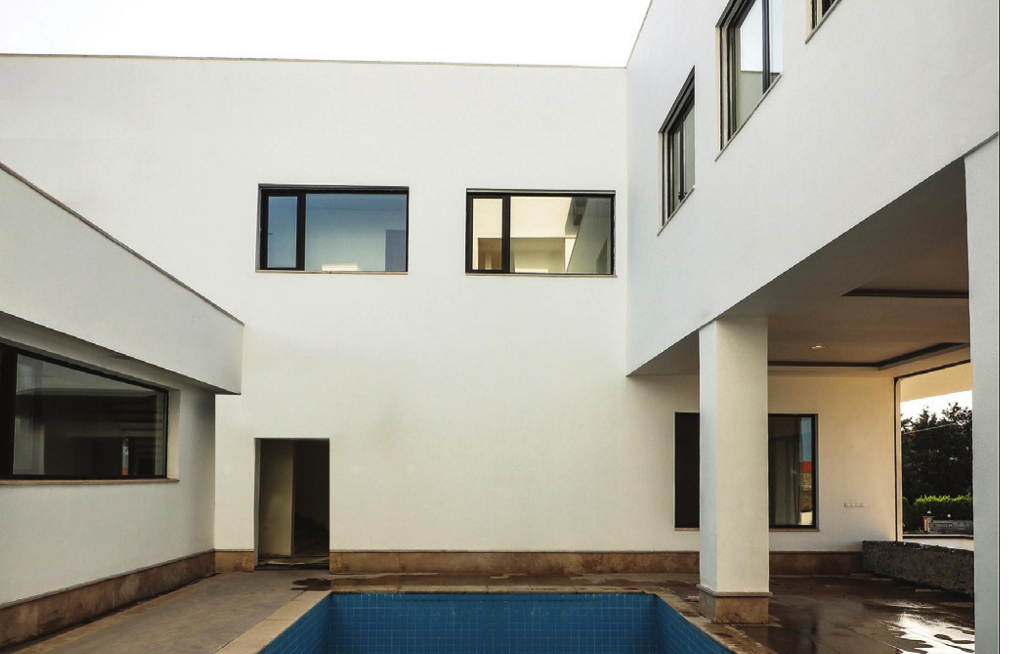Interior pool courtyard with overhanging upper storey