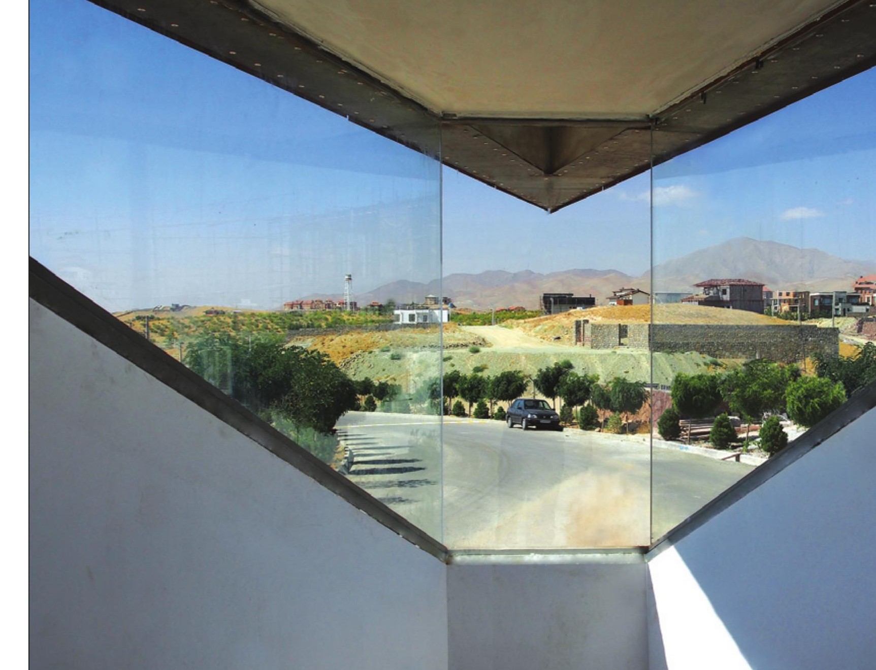 View from inside the kiosk through the central glass cut