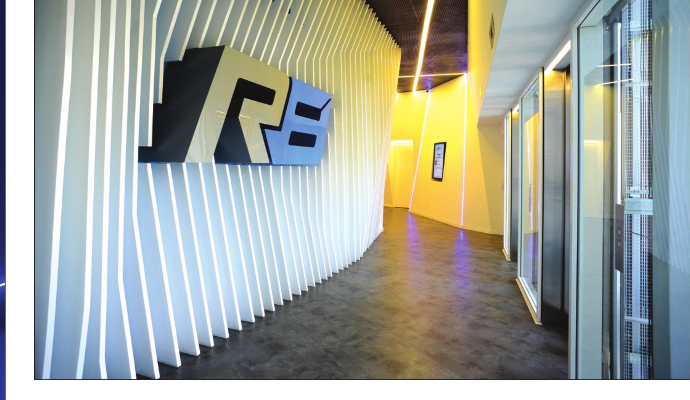 Warm gold-lit corridor with R8 logo