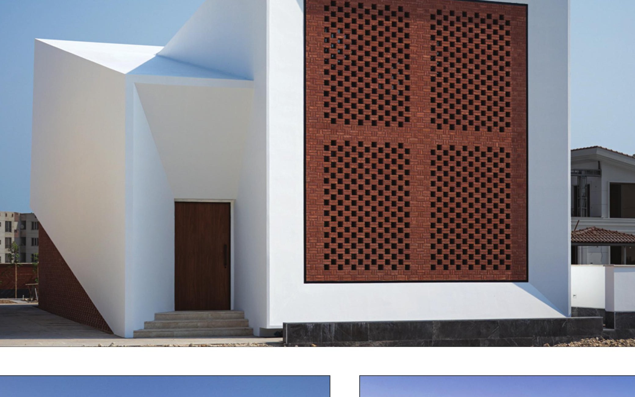 Raj Villa entrance — white volume next to perforated red brick screen