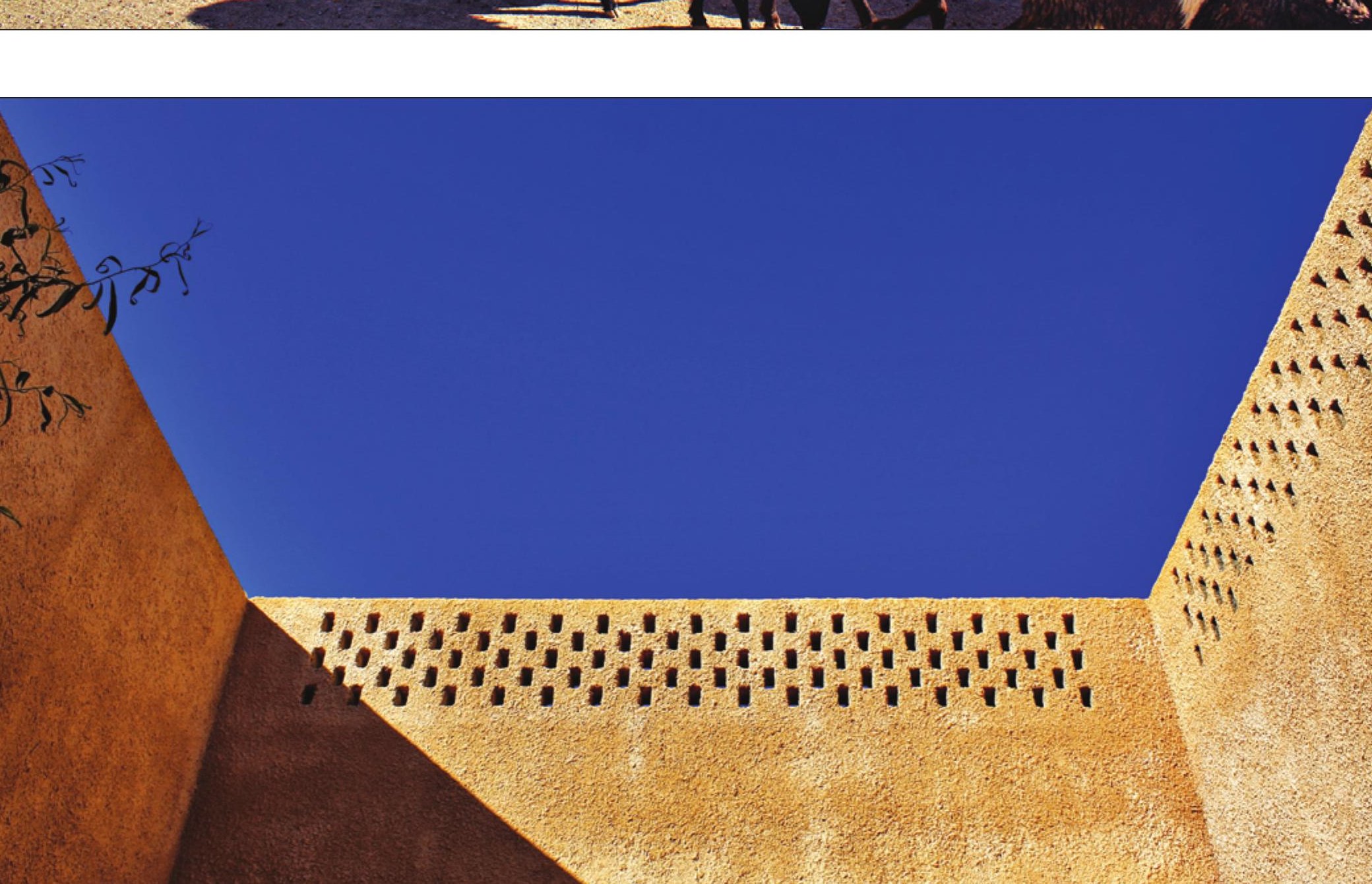 Perforated brick screen filtering light into the interior