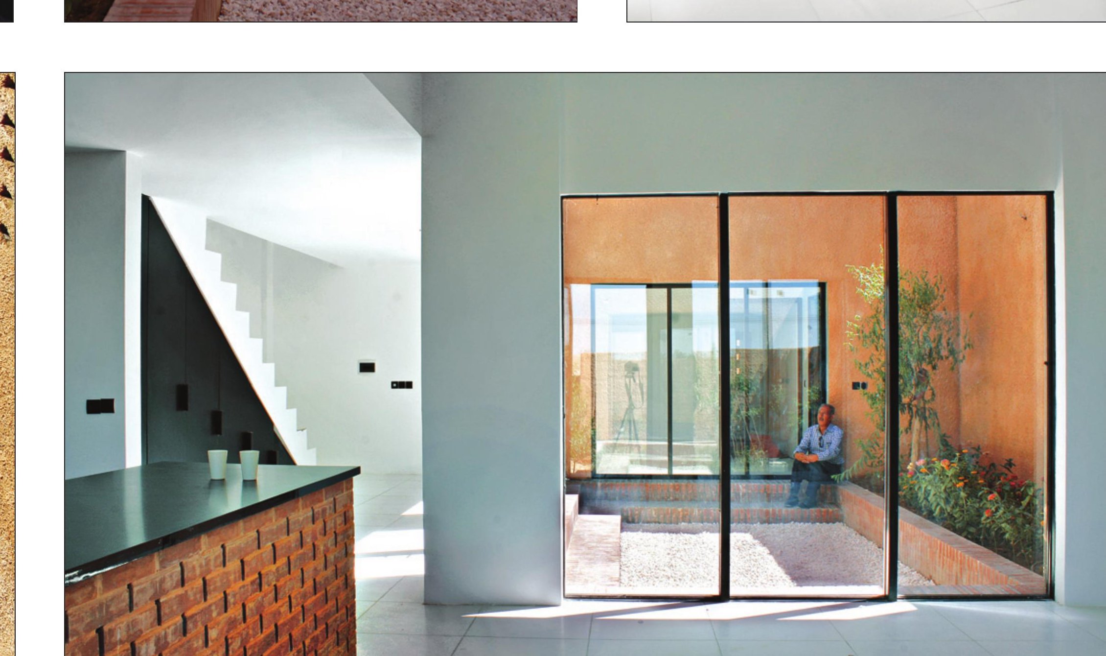 Interior living room and kitchen with brick walls
