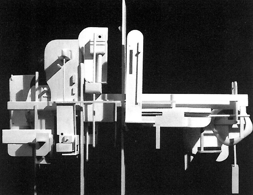 Black-and-white photograph of a Hejduk sculptural architectural model with cardboard fragments suspended in dark space