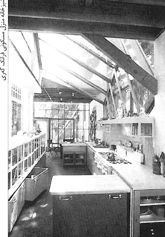 Photograph of a long interior dining hall with linear tables and overhead pendant lighting