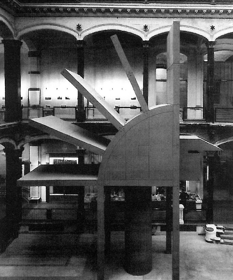 Photograph of a Hejduk architectural installation inside a multi-storey gallery hall with arcaded walls