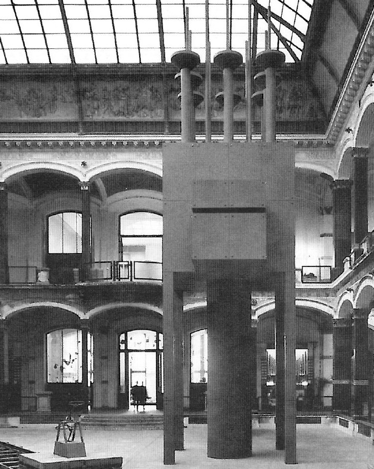 Photograph of a Hejduk installation showing tall freestanding wooden structures with peaked tops in a gallery