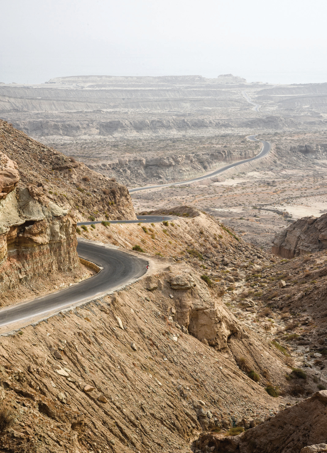 Winding road through the eroded coastal mountains near Benoud