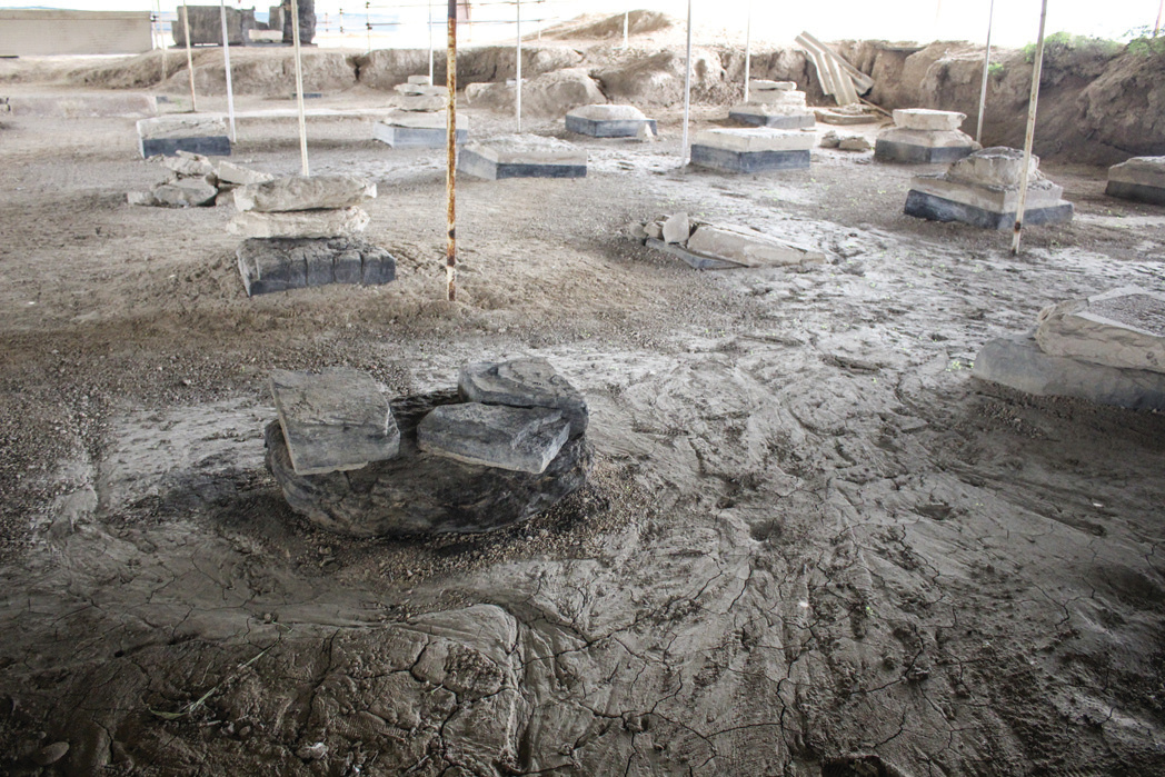 Surviving column bases of Bordak Siah Palace under a protective shelter