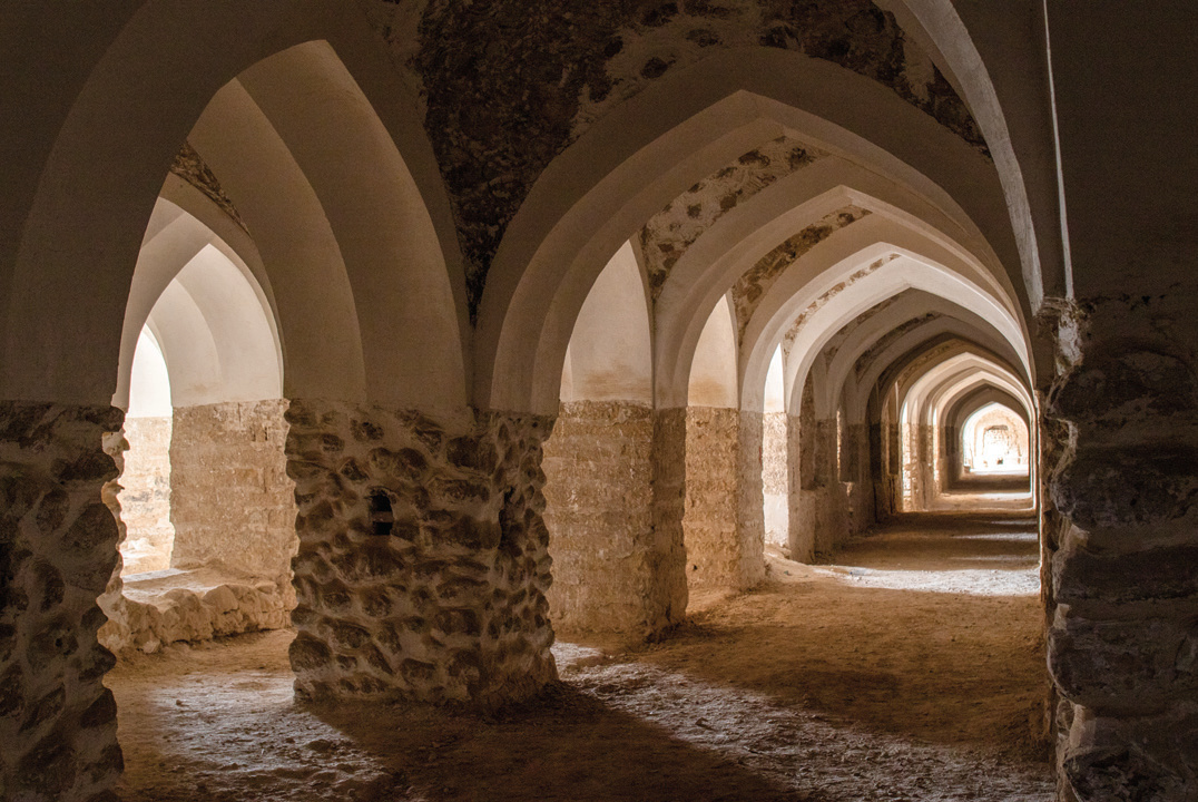 Interior arched halls of Moshir al-Molk Caravanserai in Borazjan