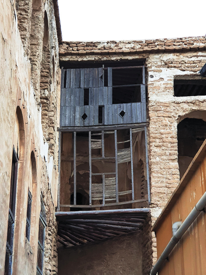 Deteriorated wooden shanashir balcony on the building