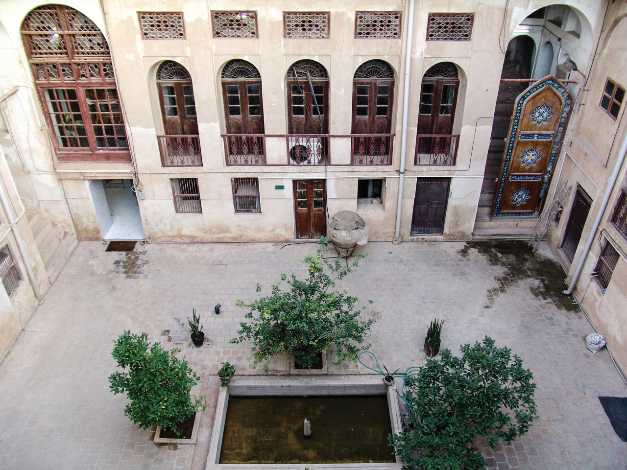 Courtyard of Golshan Edifice with pool and ornate tilework