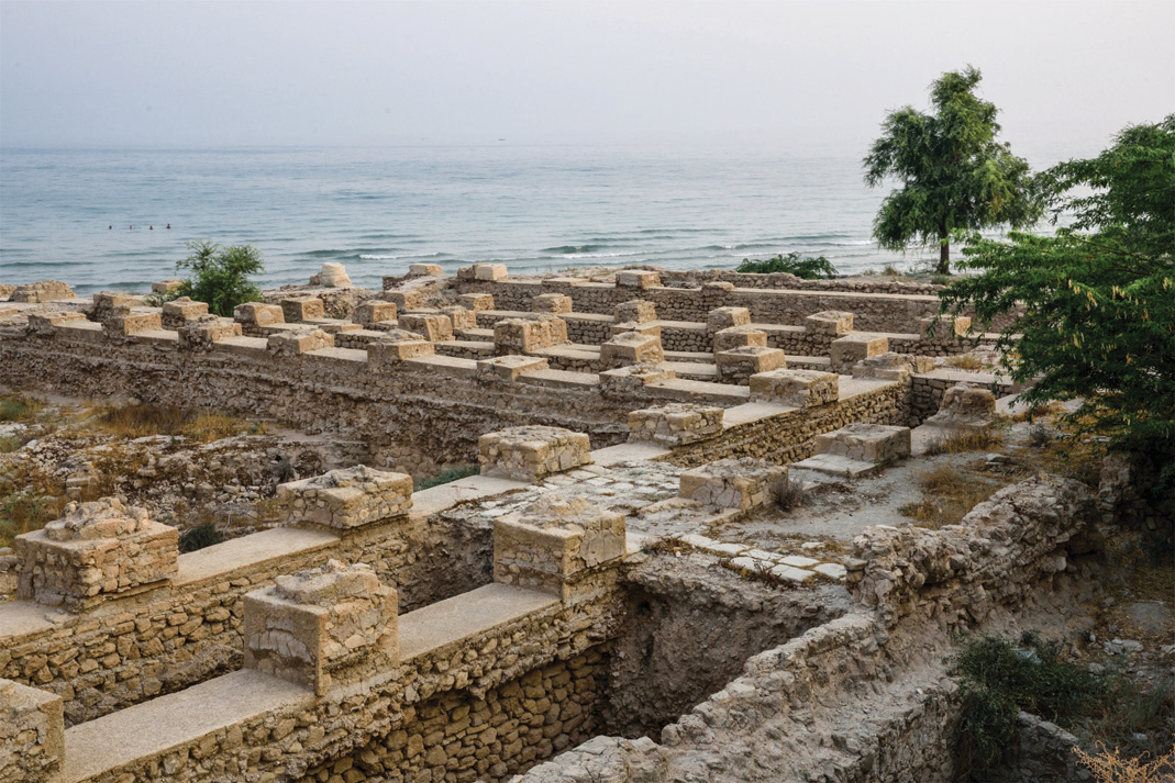 Remains of the Siraf Grand Mosque — stone foundations and walls overlooking the sea