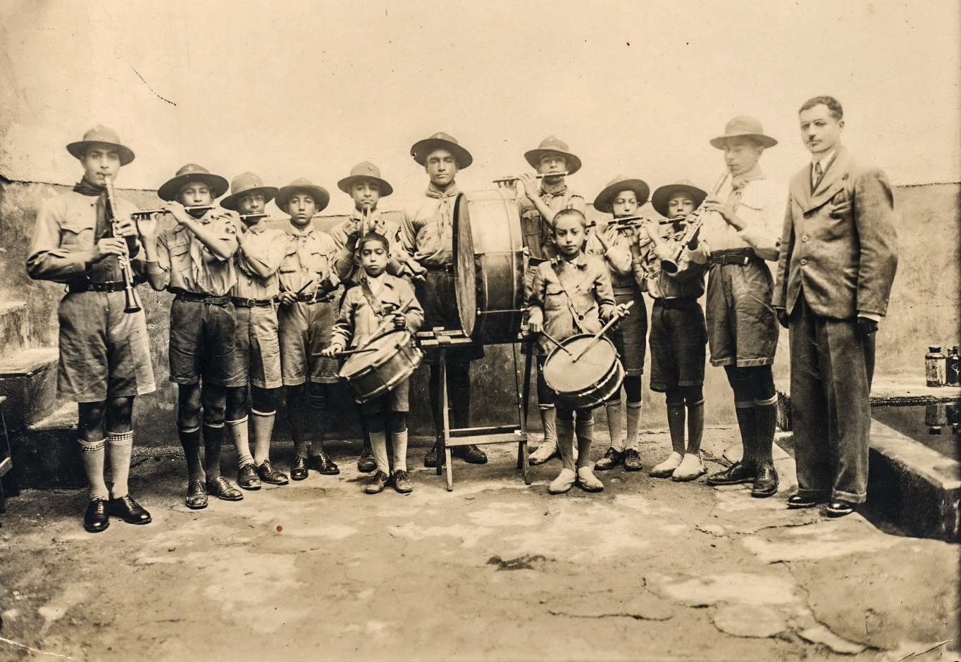 Historical photograph of the school's music group with instruments, 1937