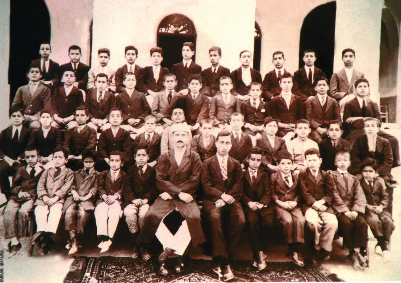 Historical sepia photograph of teachers and students of the Saadat School, circa 1901