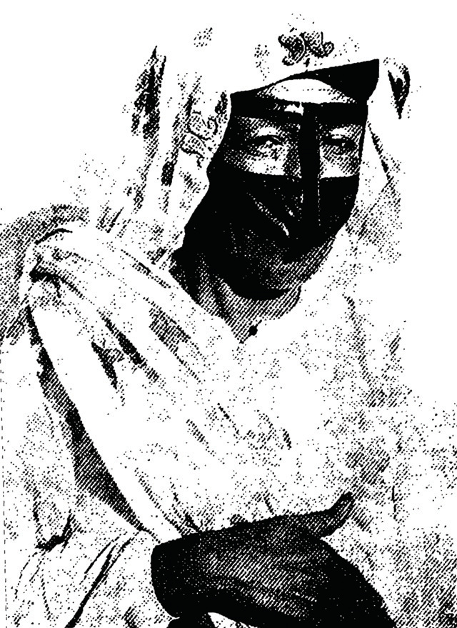 Black and white portrait of a woman wearing a traditional southern Iranian face mask (burqa)
