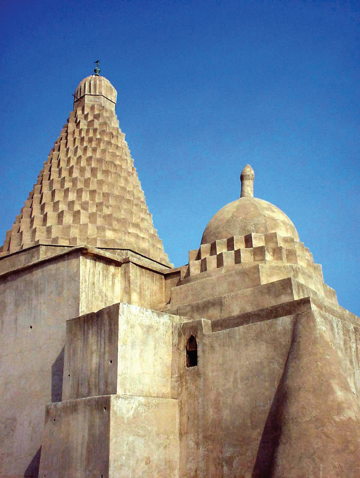 Conical tower of the shrine of Mir Mohammad Hanifeh on Khark Island, with its distinctive serrated dome and smaller dome beside it