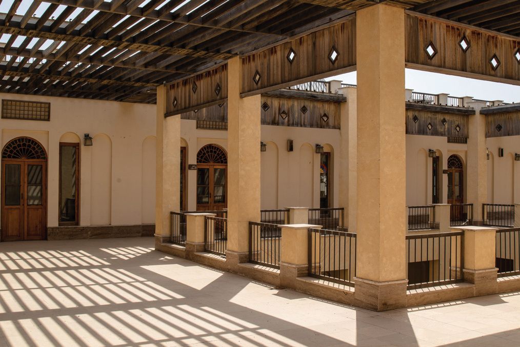 Rooftop level with columns, diamond cutouts, and timber canopy