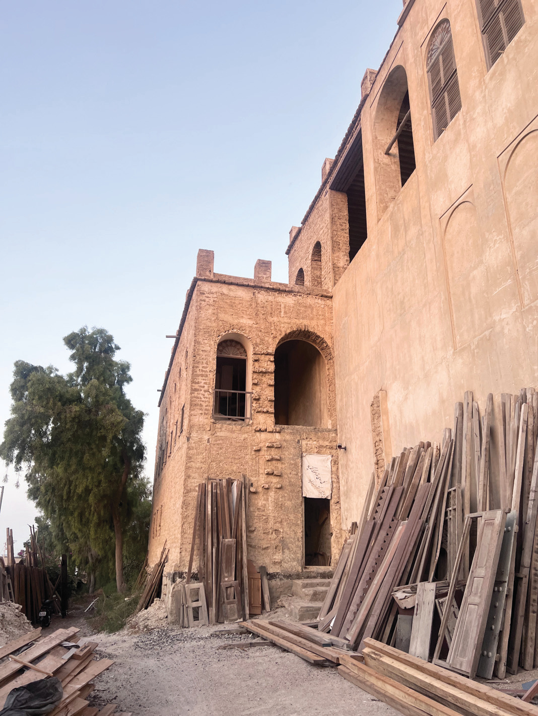 North facade detail showing brick and scaffolding materials