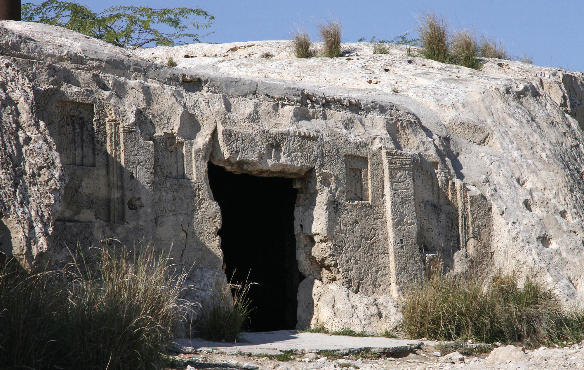Entrance to the Palmyran temple-tomb, a large opening carved into the rocky hillside