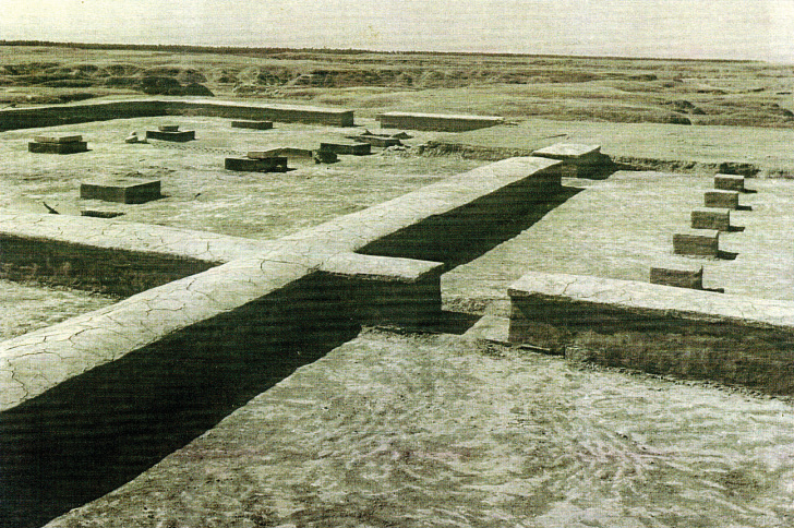 Excavated ruins of Sang Siah Palace showing stone foundations, column bases, and wall remnants