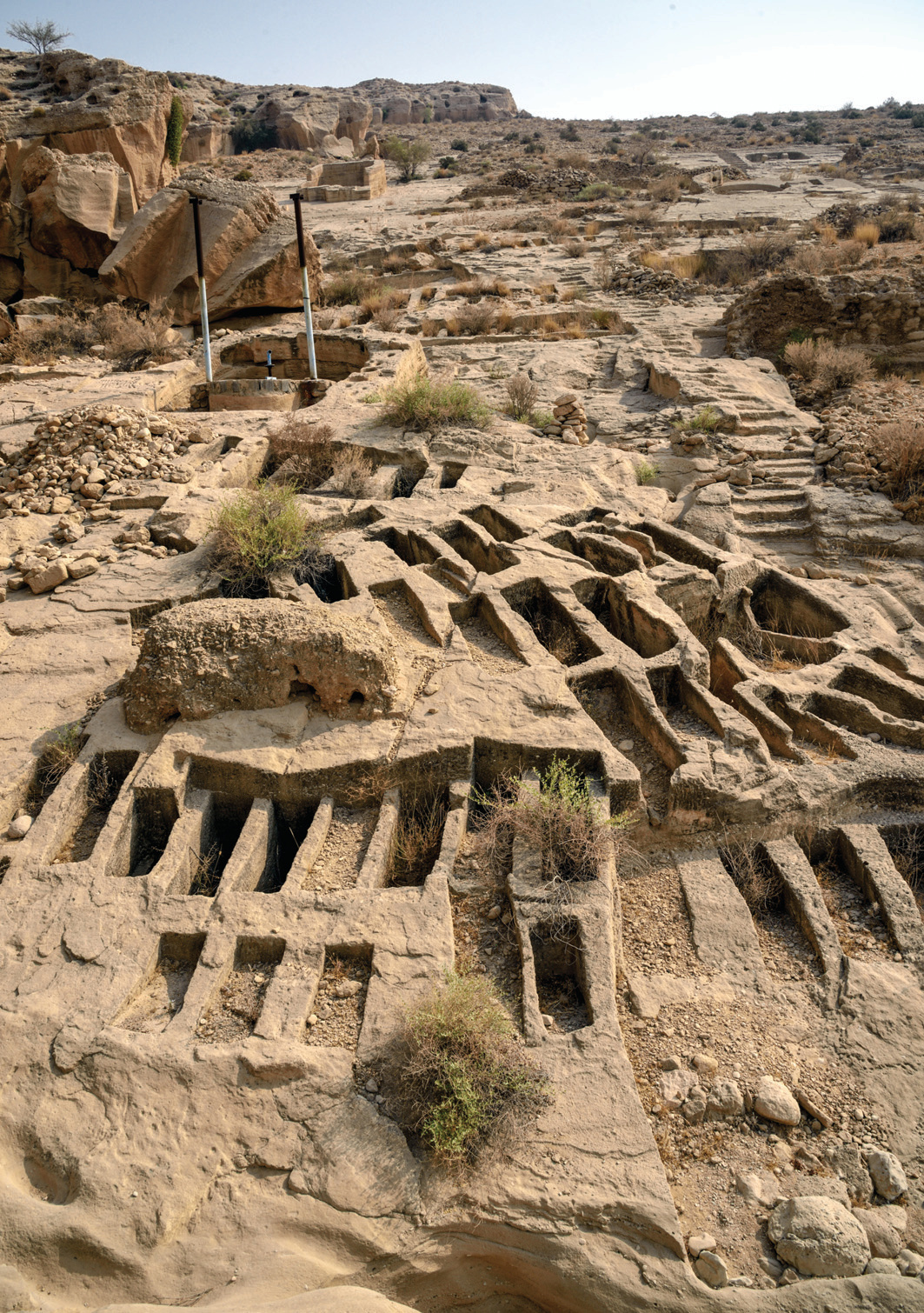 Rows of rectangular stone graves carved into the hillside in the Lir Valley