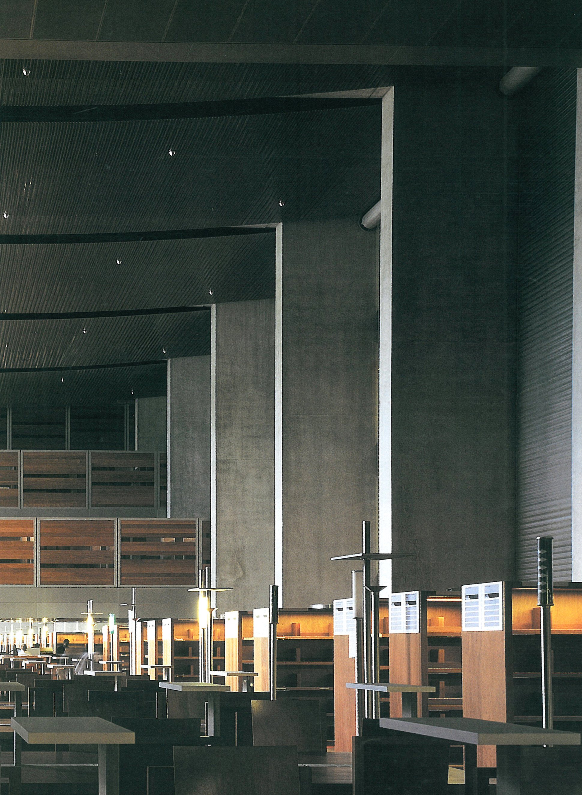 Bibliothèque nationale de France — reading room with timber ceiling, concrete walls and timber tables