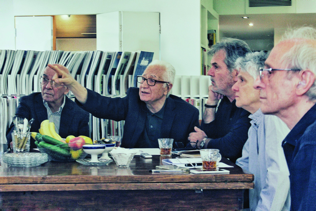 Close-up of jury members in discussion during the judging session