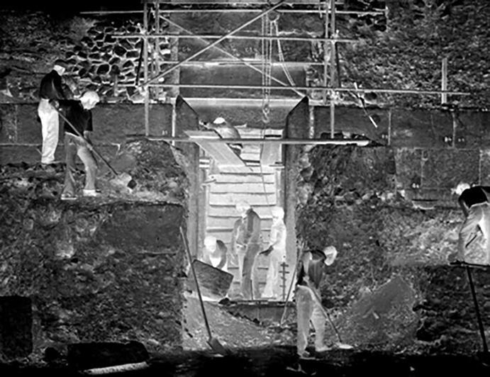 Archival photograph showing scaffolding and workers during excavation of the Anahita temple at Bishapur