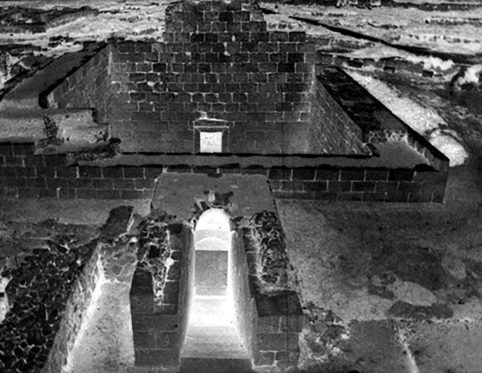 Archival black-and-white photograph of the Anahita temple interior at Bishapur showing stone walls and central corridor