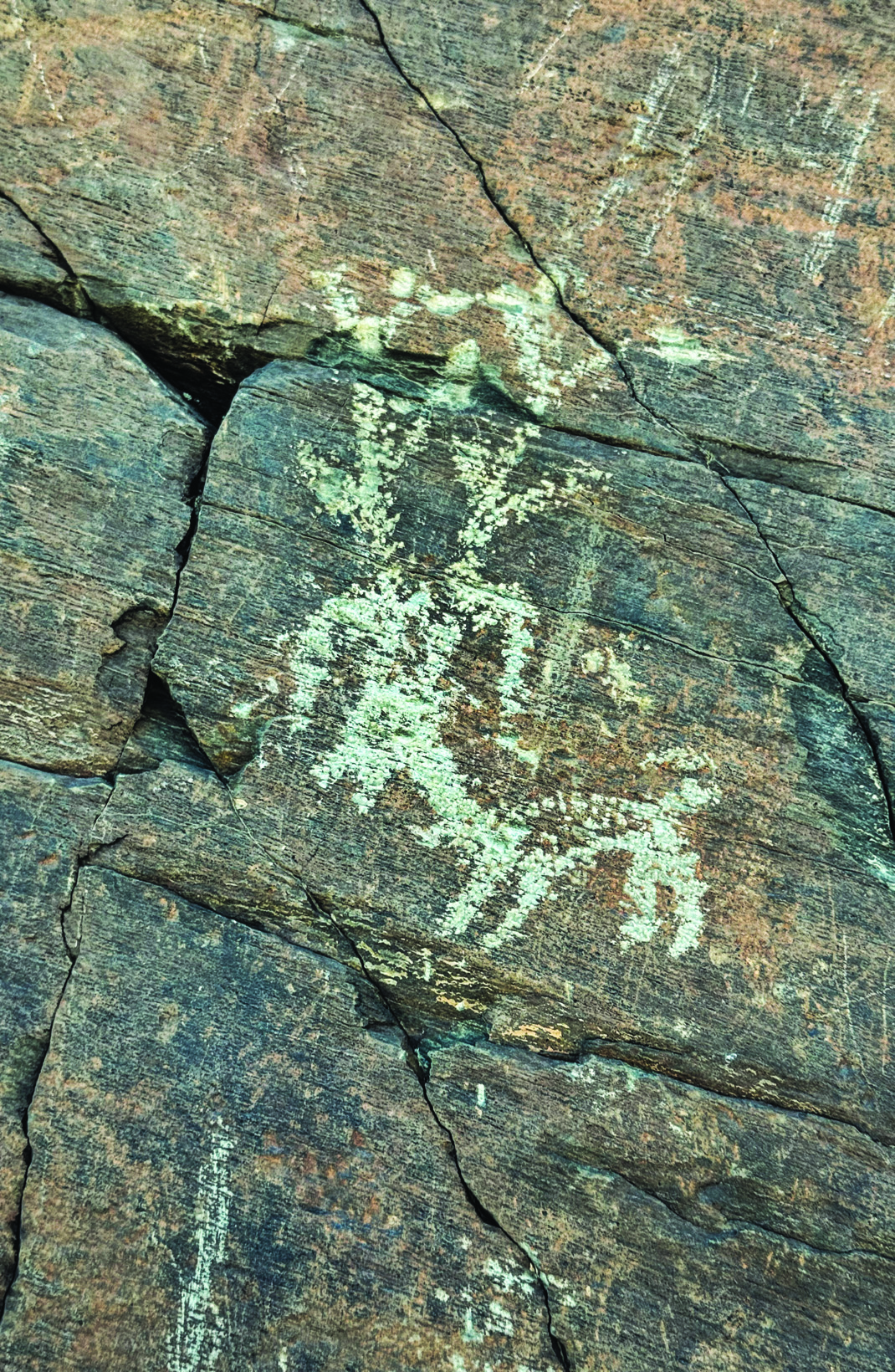Petroglyph at Darreh Negaran showing a human figure alongside a deer-like animal with exaggerated antlers