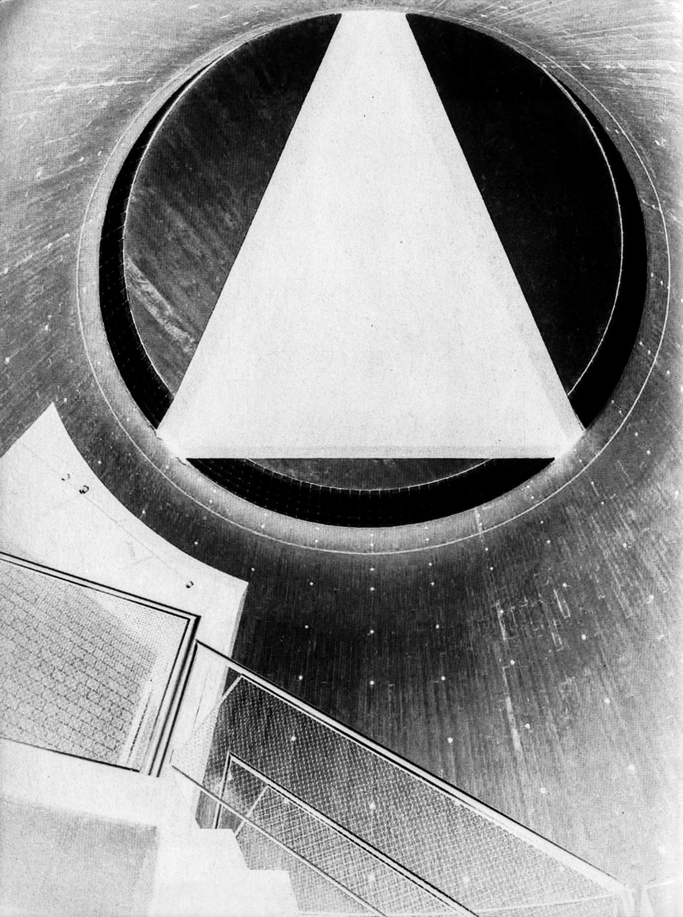 Black-and-white interior of the Yale Art Gallery stair drum, showing the monumental concrete triangle wedged in the clerestory wall with dramatic natural light entering from above