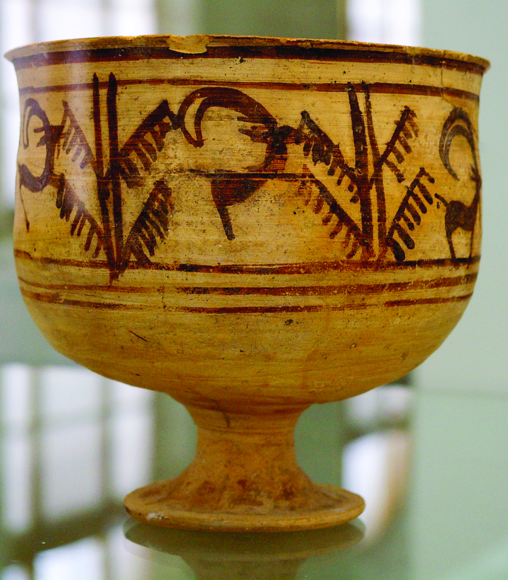 Ceramic goblet from Shahr-e Sukhteh with painted motif of a goat eating the Haoma plant