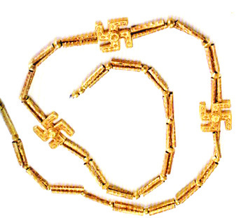 Gold necklace from Marlik with three Mithraic cross (garduneh-ye Mehr) pendants attached to a chain of tubular gold beads