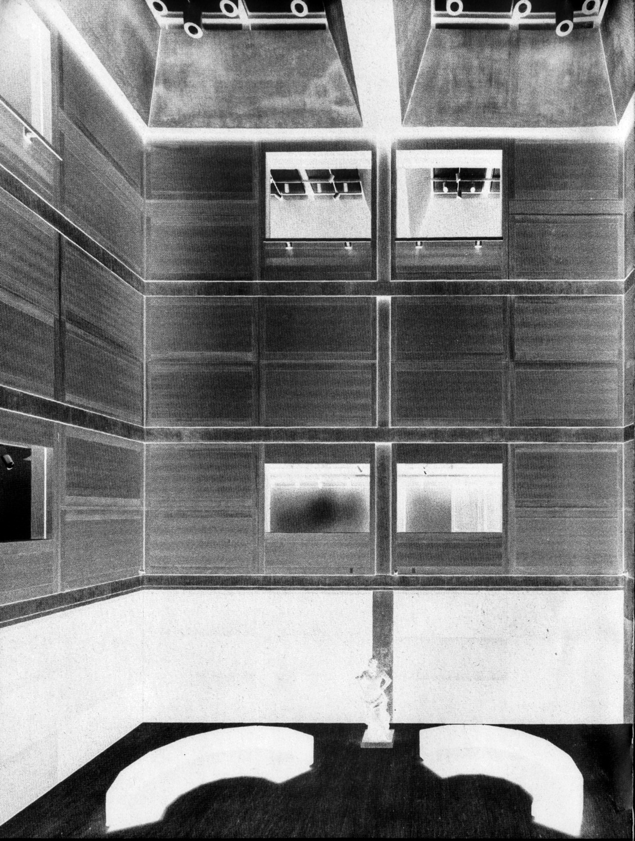 Louis Kahn's chalk study on black paper depicting the entrance court, showing the envisioned open quality with exterior material finishes and connection to the street