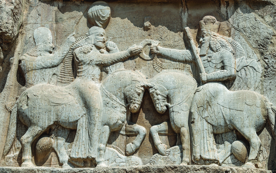 Rock relief at Naqsh-e Rostam depicting Ahura Mazda on horseback presenting the ring of sovereignty to Ardeshir Babakan