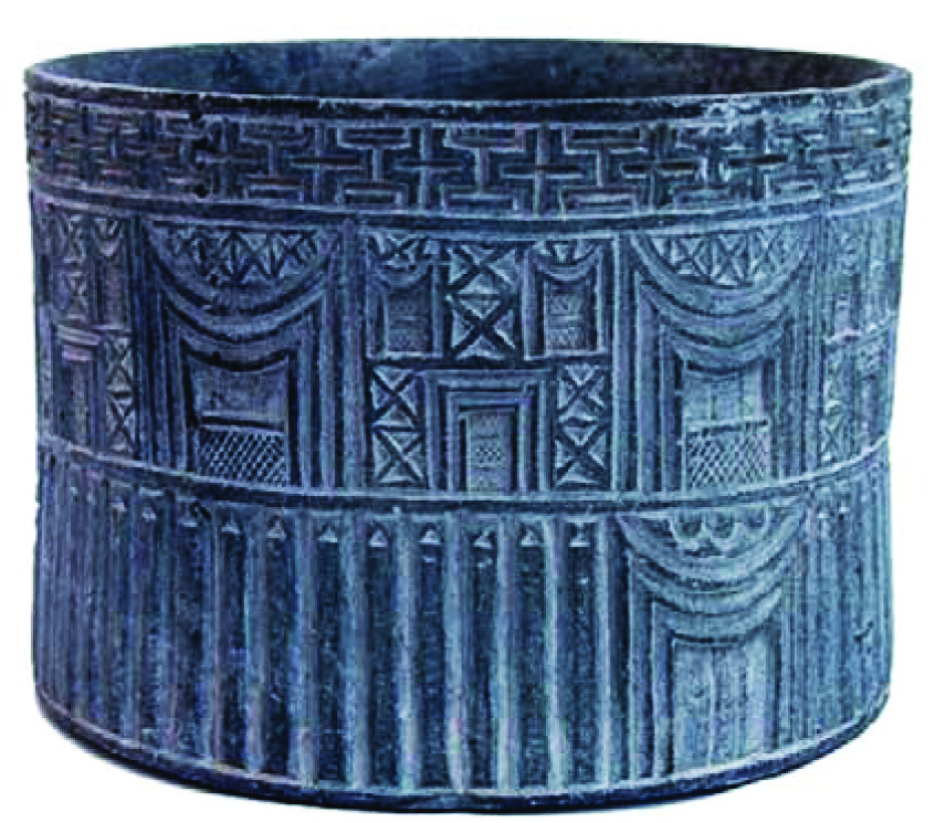 Carved stone vessel from ancient Jiroft depicting architectural forms with columns and arches in relief