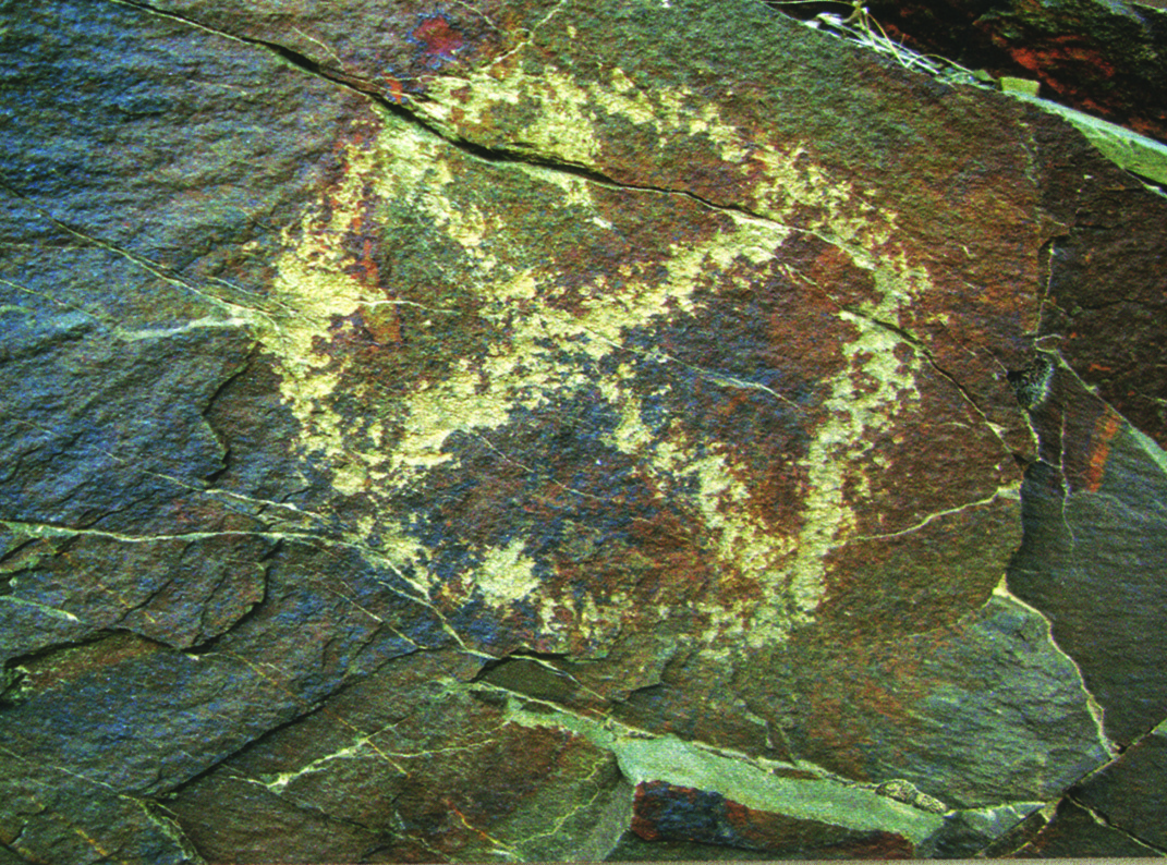 A carved circle with internal divisions on a rock face at Teimareh, showing the emergence of geometric thought