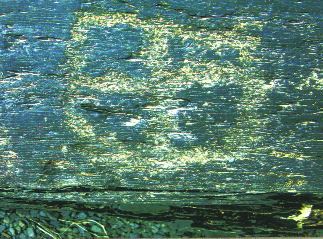 A square grid pattern carved into rock at Teimareh, resembling early mathematical or architectural notation