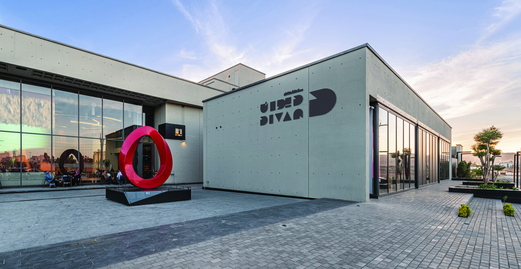 Divan Building, facade with logo and red sculpture