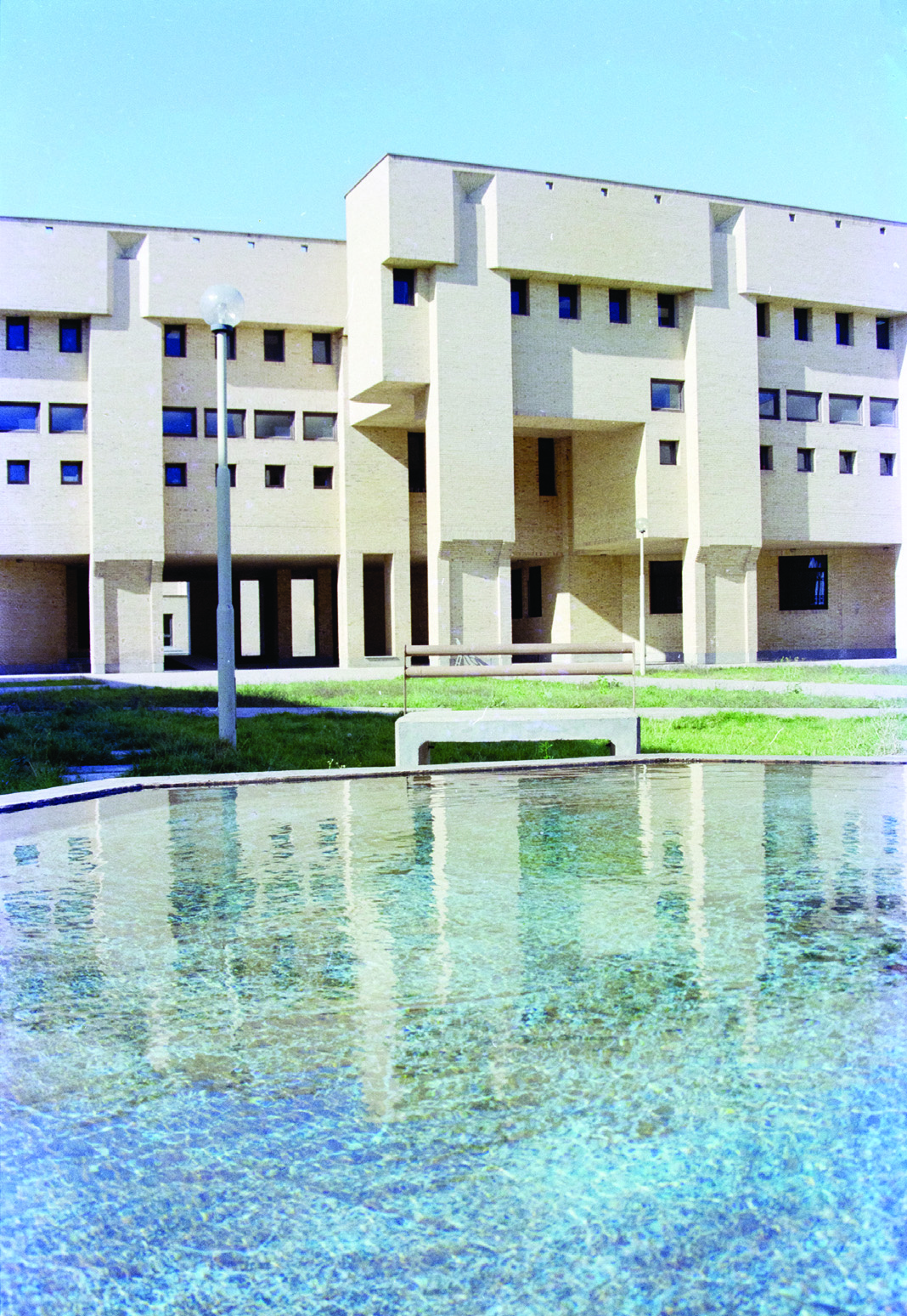 Academic building block with reflecting pool in foreground
