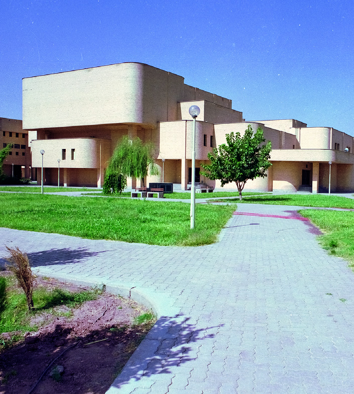 Campus buildings with landscaped gardens and pathways