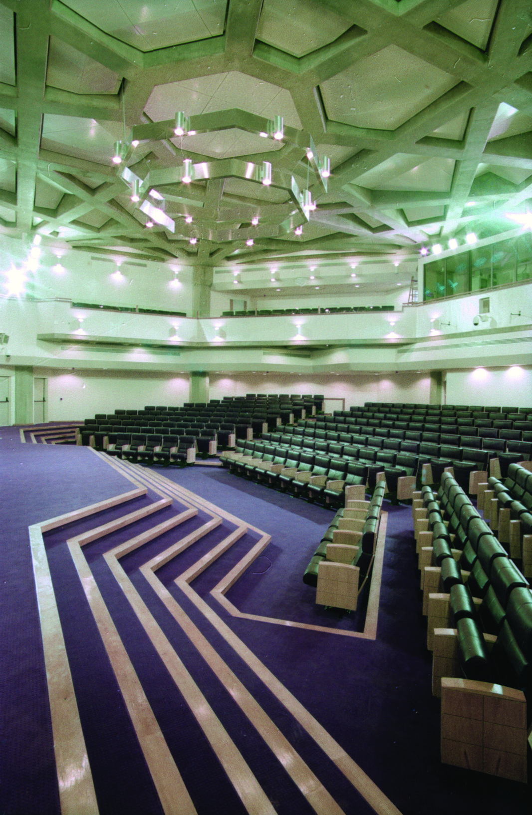 Conference auditorium hall at the National Library with geometric ceiling and seating